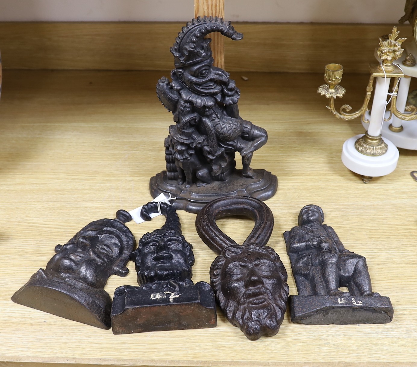 A Punch cast iron door stop and four other figural door stops, punch door stop 33cms high